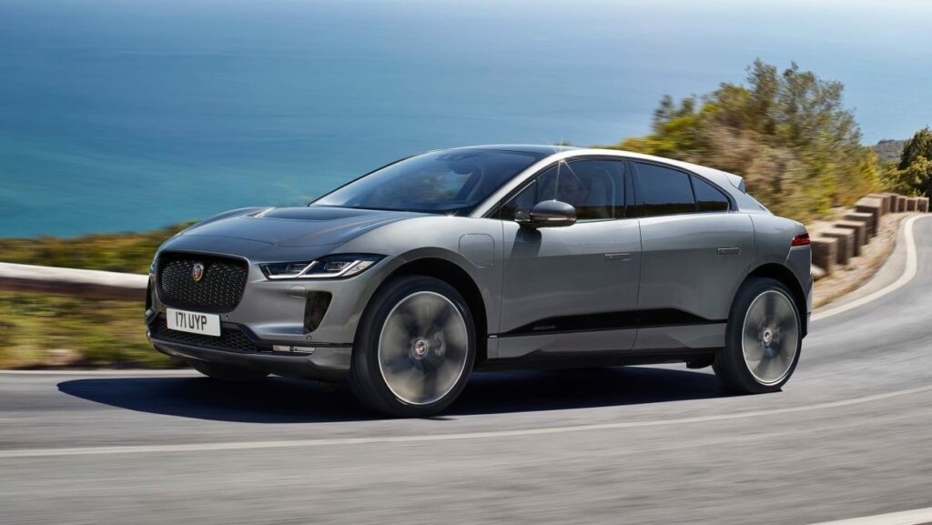 Jaguar ipace dynamic, gray clor driving on a road near the seaside