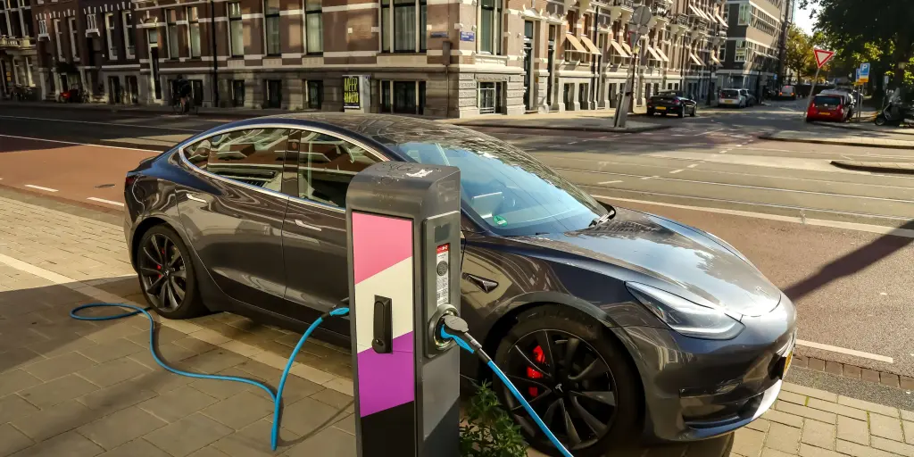 an ev charging next to the street